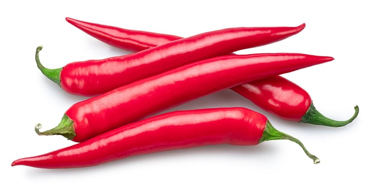 Fresh red hot chilli peppers isolated on white background